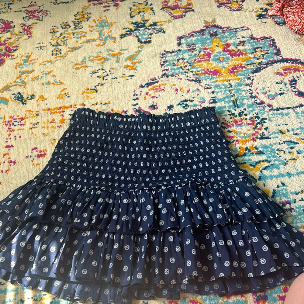 Ruffle blue skirt with white details.